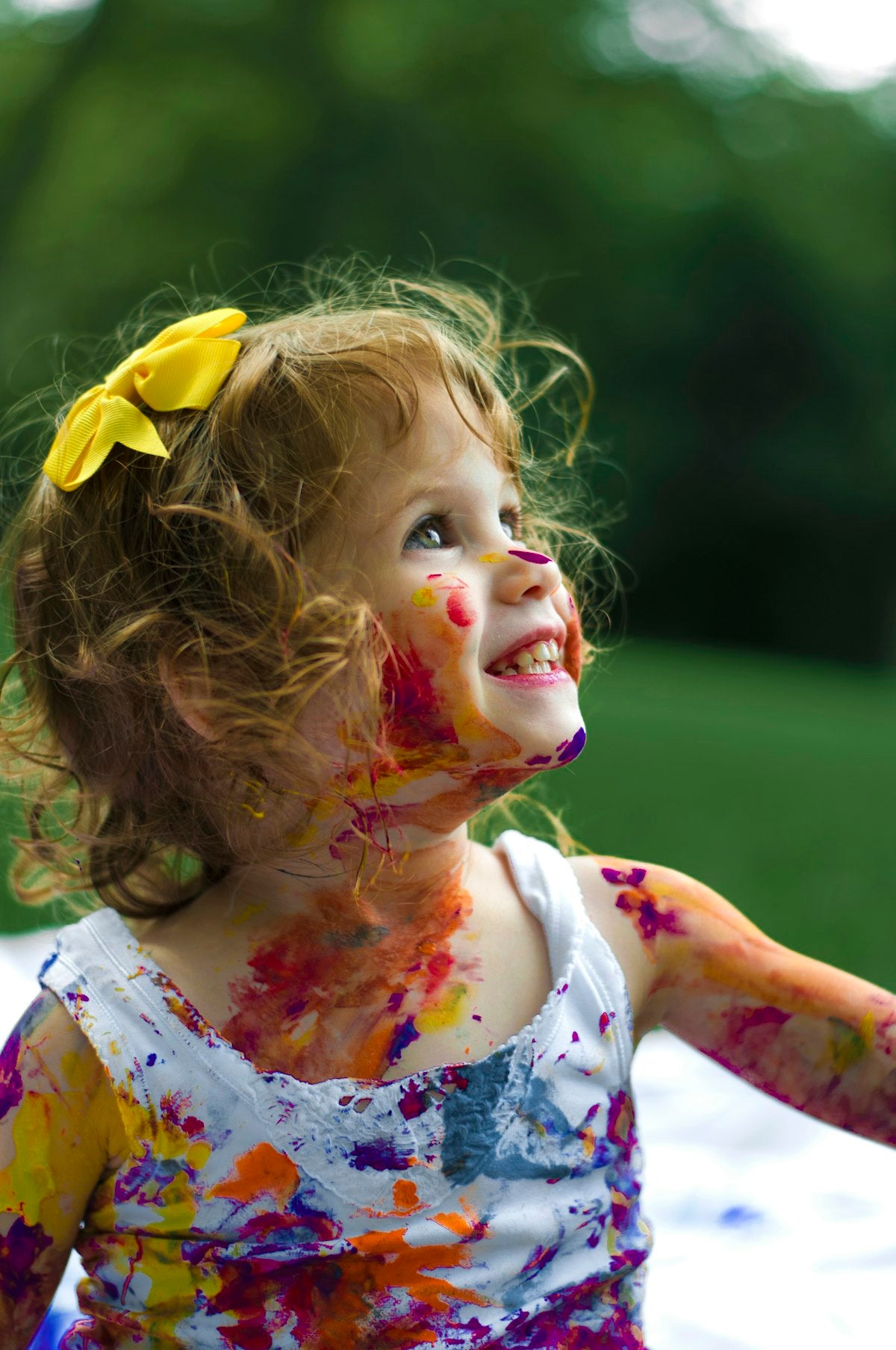 Children smiling and playing together dressed in cute outfits